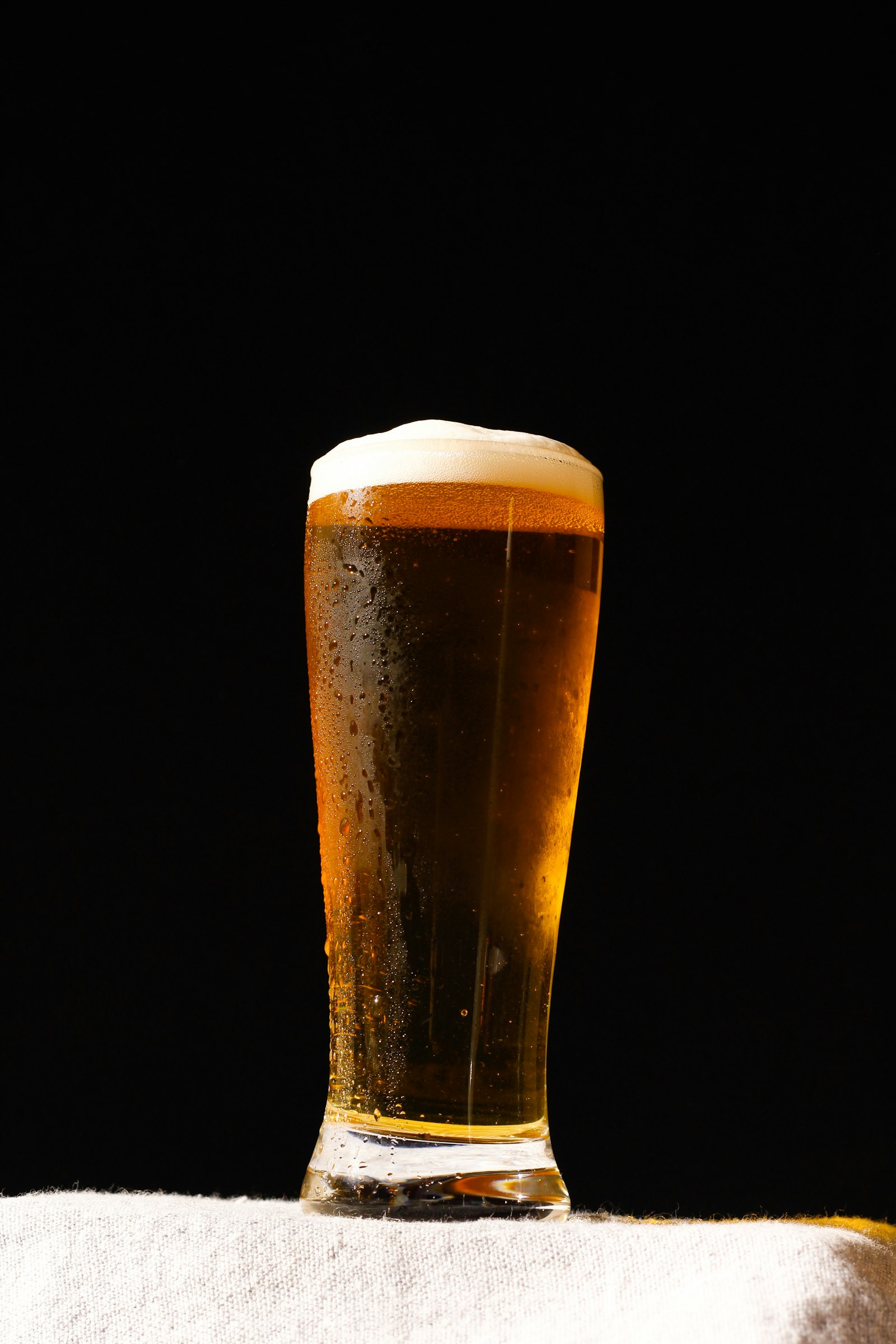 A freshly poured glass of golden craft beer